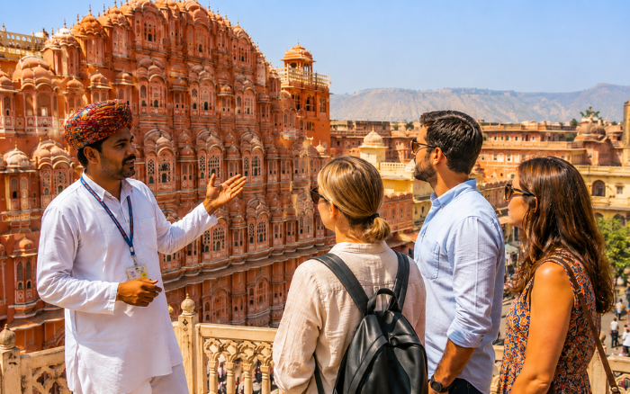 Private Jaipur tour guide explaining Hawa Mahal to tourists