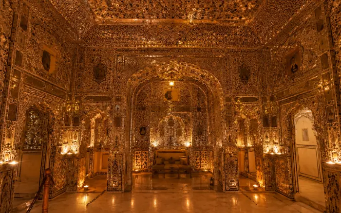 Intricate mirror work inside Sheesh Mahal at Amber Fort Jaipur, one of the most beautiful palaces in Rajasthan.