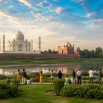 Visitors viewing the Taj Mahal from Mehtab Bagh during the Taj Mahal Friday Closure in Agra.