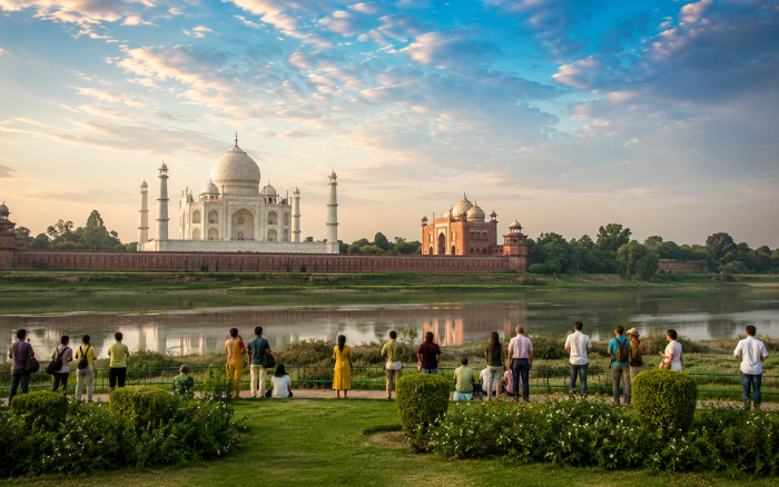 Visitors viewing the Taj Mahal from Mehtab Bagh during the Taj Mahal Friday Closure in Agra.