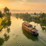 Kerala Backwaters Tour featuring a traditional houseboat cruising through the scenic backwaters of Alleppey, Kerala, surrounded by coconut palms and peaceful waterways.
