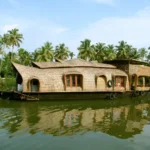 Traditional Kerala houseboat cruising through lush backwaters