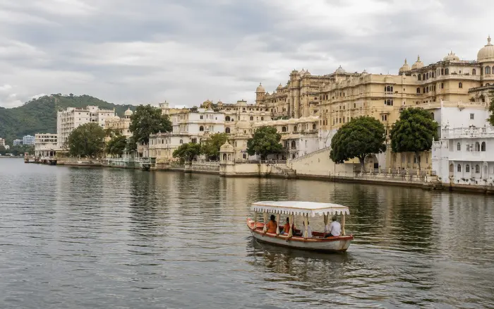 Boat ride on Udaipur Lake with historic palace views